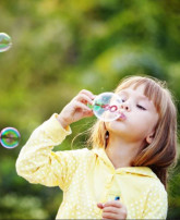 new/kidblowingbubbles-lowresportrait.jpg